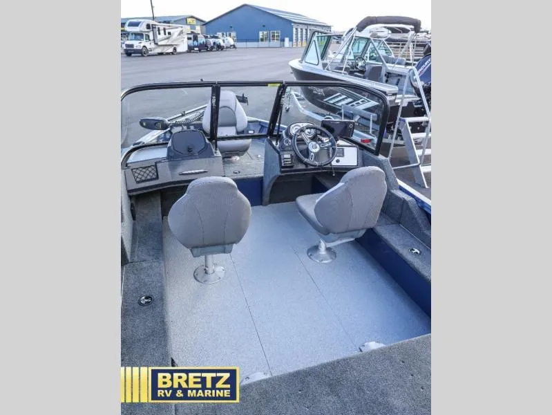 Slide: The Image of 2025 Excursion 176 DC boat interior with dual seats and steering console at Bretz RV & Marine. - 8