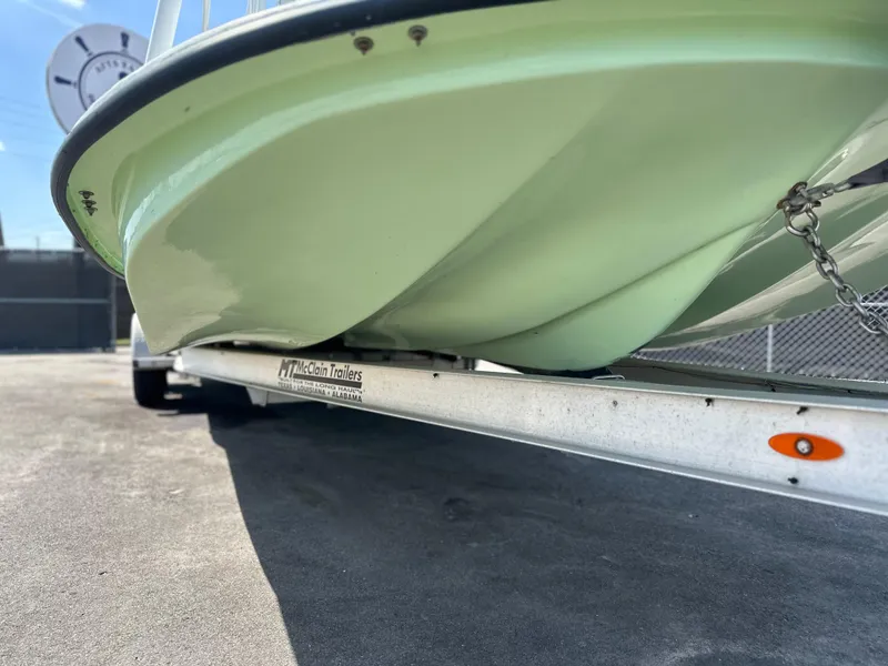 Slide: The Image of 2023 Shallow Master 240 SMS boat on trailer, close-up of hull design. - 13