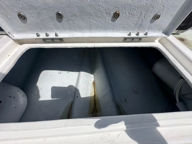 Slide: The Image of Open storage compartment of 2023 Shallow Master 240 SMS boat, showing interior details. - 28