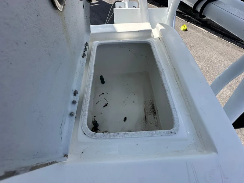 Slide: The Image of Open storage compartment on 2023 Shallow Master 240 SMS boat, showing interior details. - 38