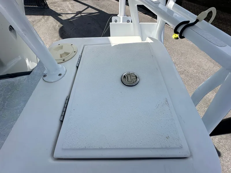 Slide: The Image of 2023 Shallow Master 240 SMS boat hatch with secure latch and white finish. - 39