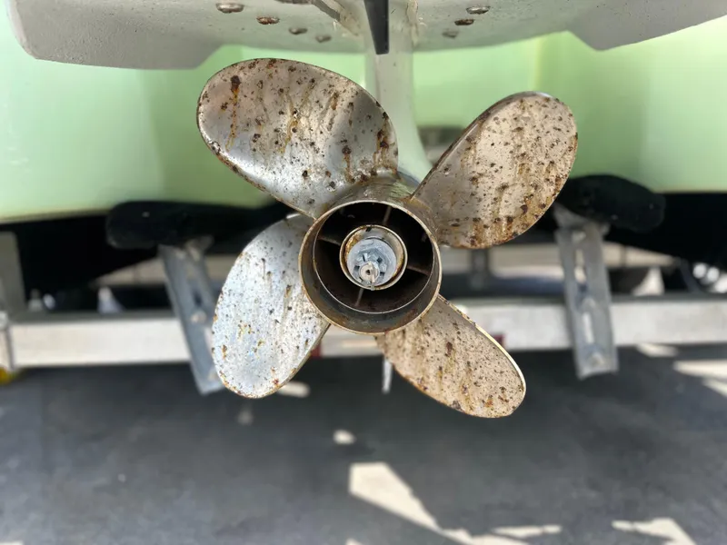 Slide: The Image of Propeller of 2023 Shallow Master 240 SMS boat, showing wear and rust. - 7