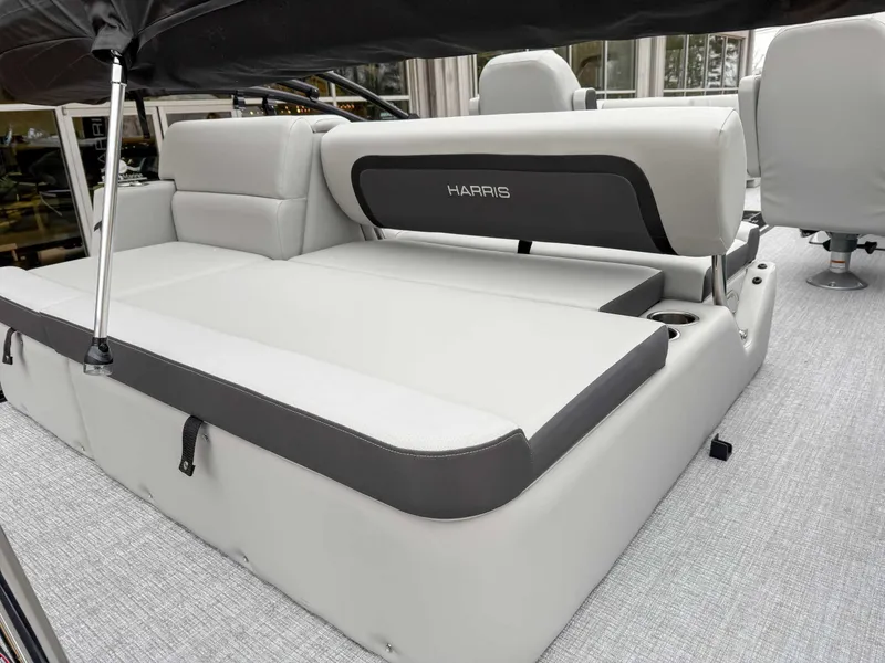 Slide: The Image of 2025 Harris CRUISER 230 SLDH boat interior with luxurious seating and modern design. - 10