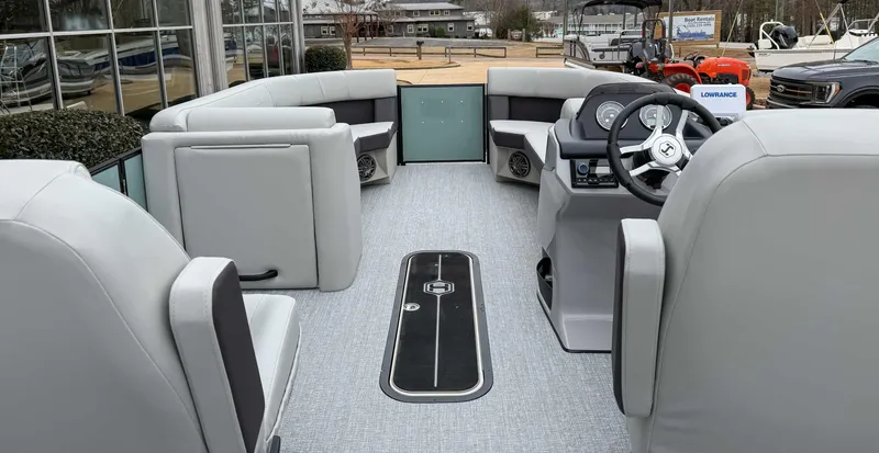Slide: The Image of 2025 Harris CRUISER 230 SLDH pontoon boat interior with modern seating and steering console. - 11