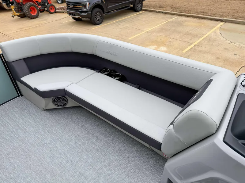 Slide: The Image of 2025 Harris CRUISER 230 SLDH boat interior with sleek seating and cup holders. - 13