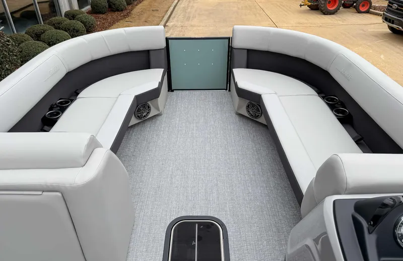 Slide: The Image of Luxurious seating on 2025 Harris CRUISER 230 SLDH pontoon boat with cup holders and speakers. - 14
