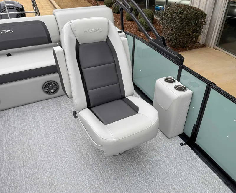 Slide: The Image of Luxury seating on 2025 Harris CRUISER 230 SLDH boat, featuring cup holders and modern design. - 17