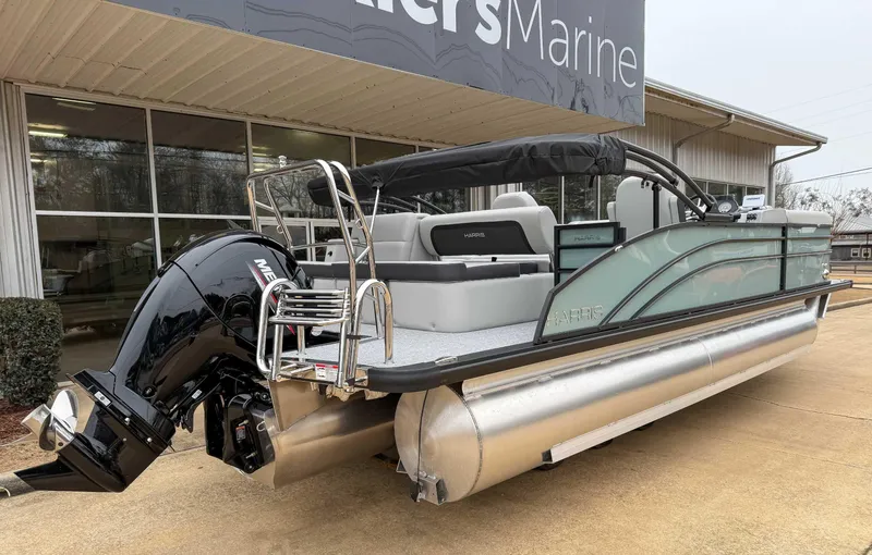 Slide: The Image of 2025 Harris CRUISER 230 SLDH pontoon boat with Mercury outboard motor at dealership. - 8