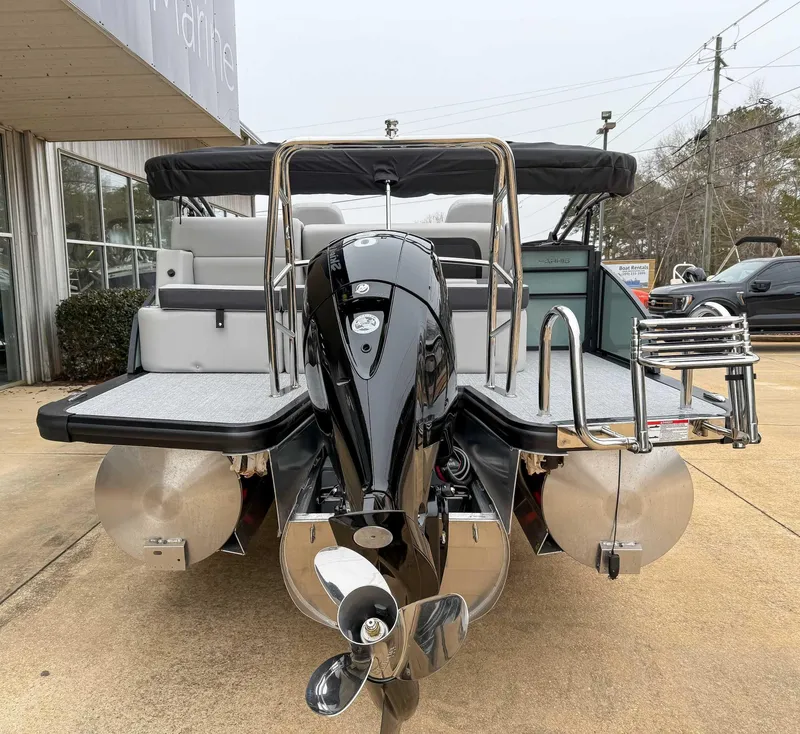 Slide: The Image of 2025 Harris CRUISER 230 SLDH pontoon boat with sleek outboard motor and spacious deck. - 9