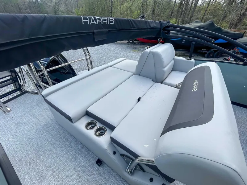 Slide: The Image of 2025 Harris CRUISER 230 SLDH boat with sleek seating and cup holders. - 10