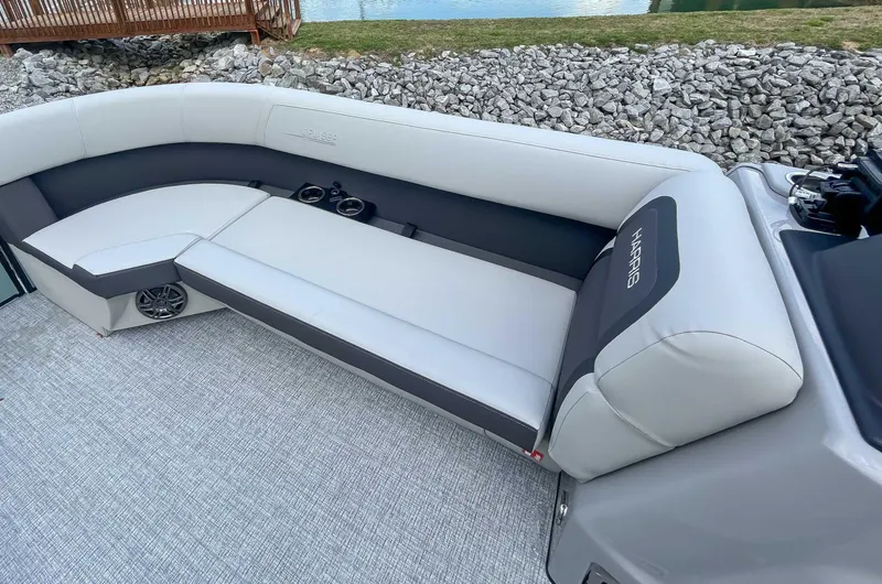 Slide: The Image of Luxurious seating on 2025 Harris CRUISER 230 SLDH boat, featuring sleek design and cup holders. - 13