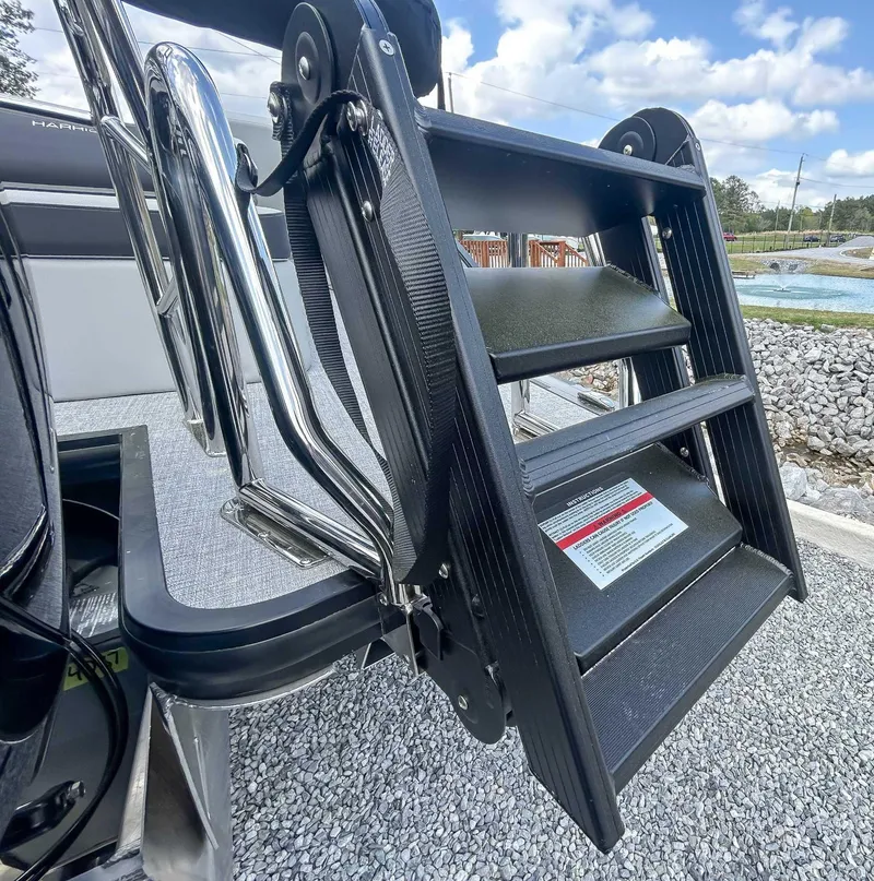 Slide: The Image of Ladder of 2025 Harris CRUISER 230 SLDH boat, set against a gravel background. - 17