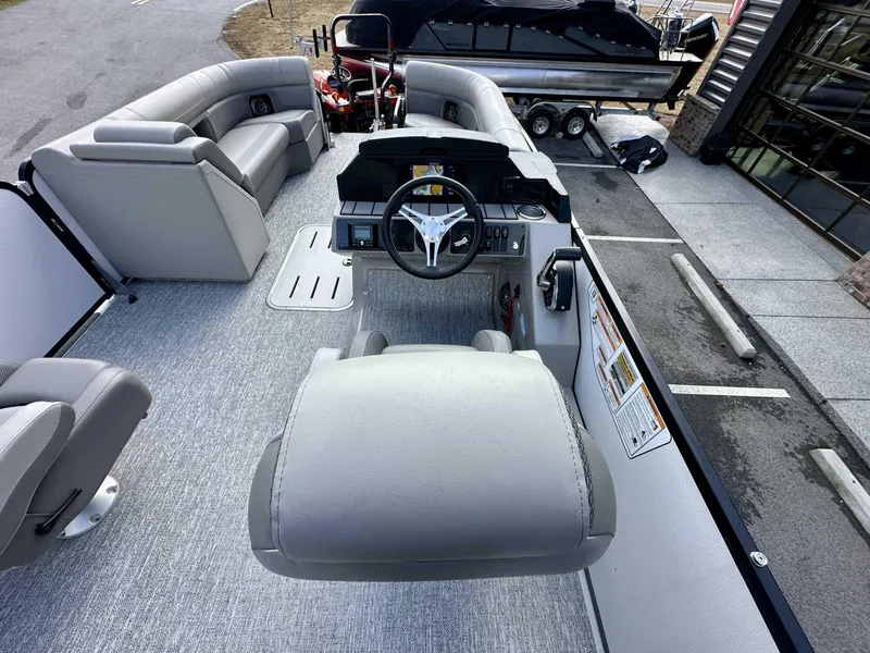 Slide: The Image of 2024 Premier 250 Solaris RL boat interior with steering console and seating. - 16