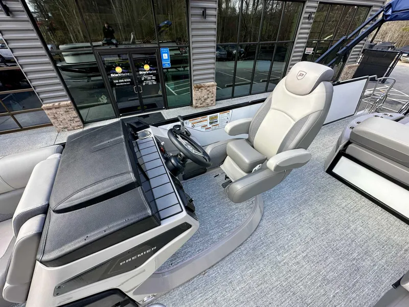 Slide: The Image of 2024 Premier 250 Solaris RL boat interior with captain's chair and control panel. - 19