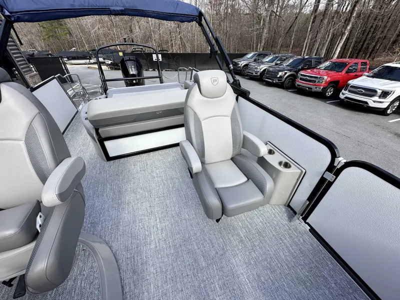 Slide: The Image of 2024 Premier 250 Solaris RL pontoon boat interior with gray seating and cup holders. - 20
