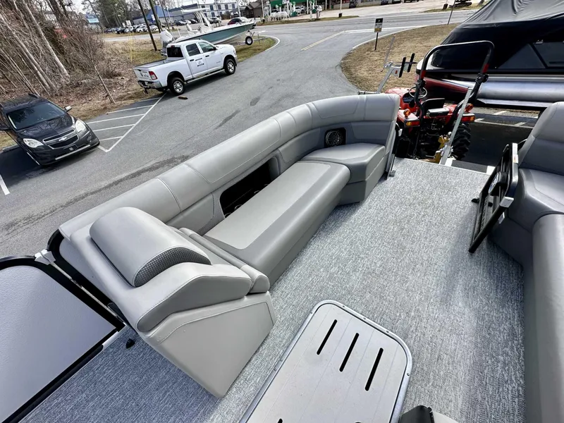 Slide: The Image of 2024 Premier 250 Solaris RL pontoon boat with spacious seating and modern design. - 22