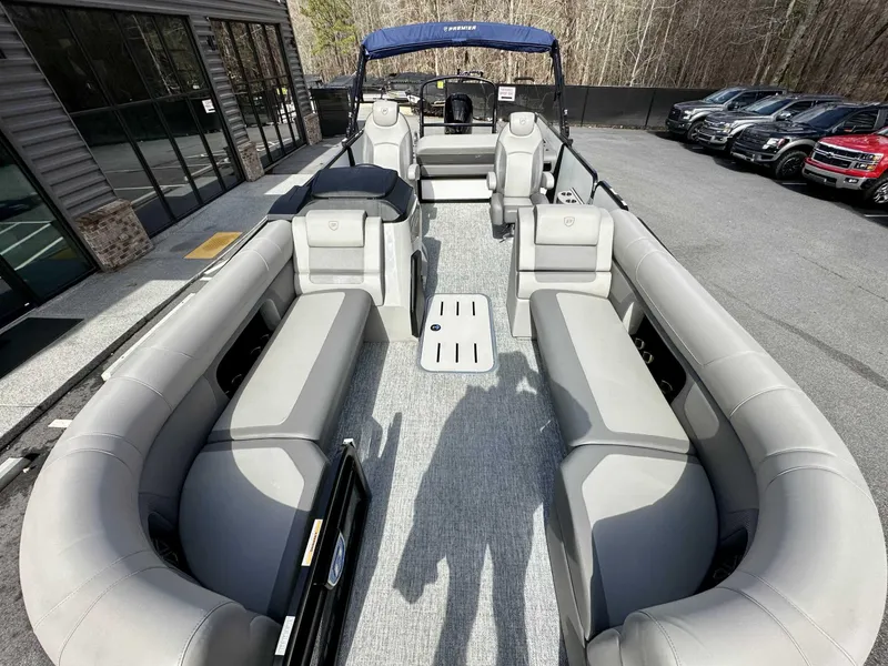 Slide: The Image of 2024 Premier 250 Solaris RL pontoon boat with spacious seating and modern design. - 23