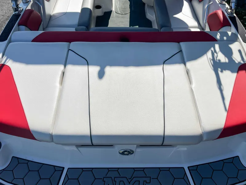 Slide: The Image of 2015 MasterCraft NXT20 boat interior with red and white seating. - 8