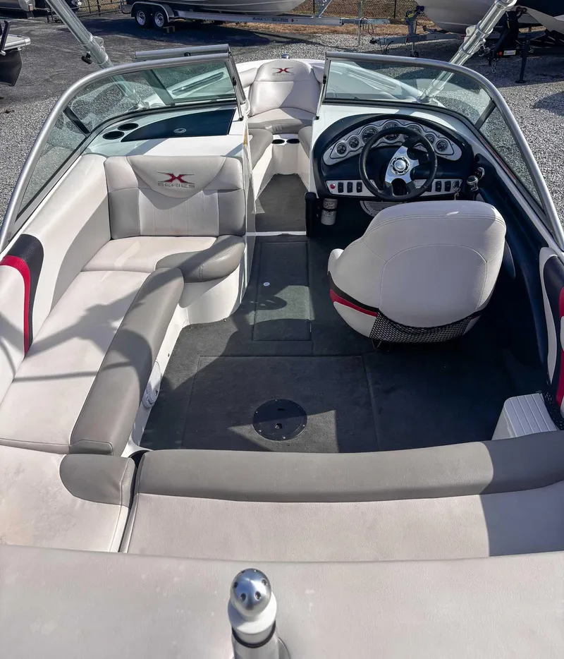 Slide: The Image of 2008 MasterCraft X1 boat interior with steering wheel and seating. - 11