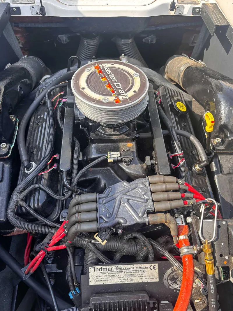 Slide: The Image of 2008 MasterCraft X1 engine with visible wiring and components. - 19