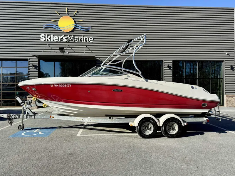 Slide: The Image of 2007 Sea Ray 230 Select boat on trailer outside Skier's Marine building. - 1