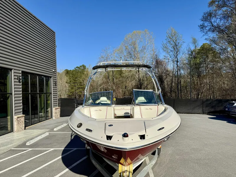 Slide: The Image of 2007 Sea Ray 230 Select boat parked outdoors on a sunny day. - 3