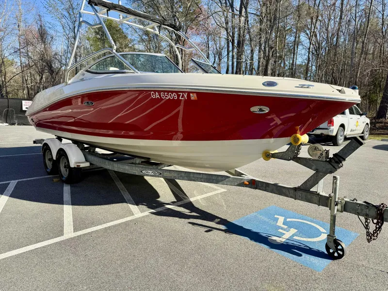Slide: The Image of 2007 Sea Ray 230 Select boat on trailer in parking lot. - 4