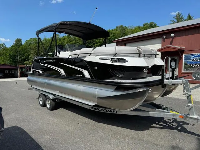 Slide: The Image of 2024 Princecraft Vogue® 23 RL pontoon boat on trailer, parked outdoors. - 5