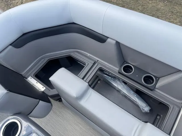 Slide: The Image of 2025 Princecraft Vectra 19 L boat interior with storage and cup holders. - 10