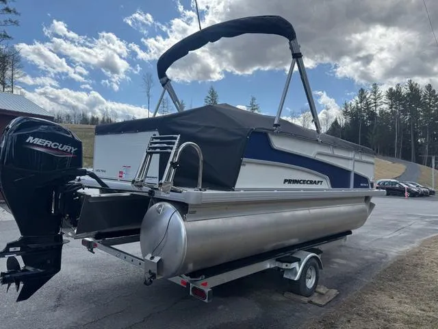 Slide: The Image of 2025 Princecraft Vectra 19 L 60HP pontoon boat on trailer, outdoors under cloudy sky. - 5