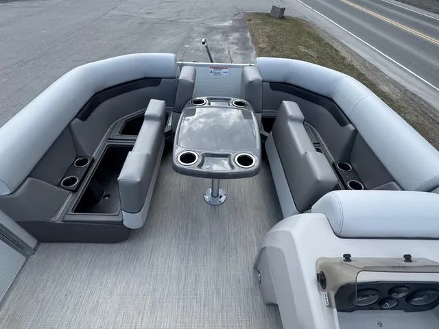 Slide: The Image of 2025 Princecraft Vectra 19 L 60HP pontoon boat interior with seating and table. - 8