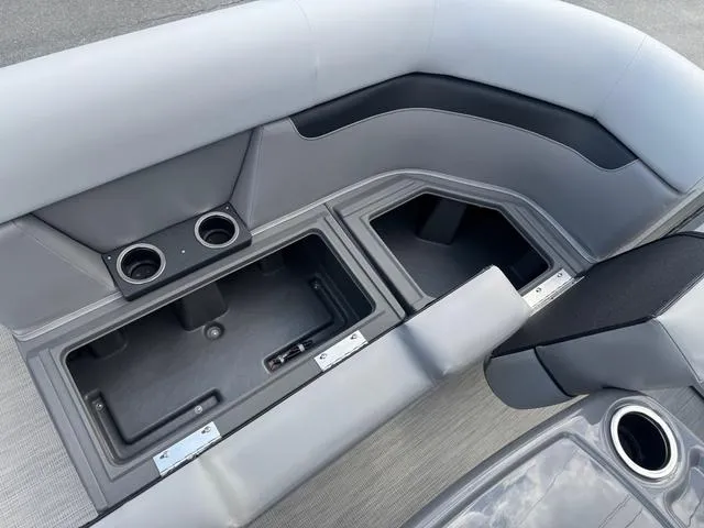 Slide: The Image of 2025 Princecraft Vectra 19 L 60HP boat interior with storage compartments and cup holders. - 9