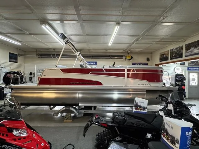 Slide: The Image of 2025 Princecraft Vectra 21 RL 115HP pontoon boat displayed in a showroom. - 1