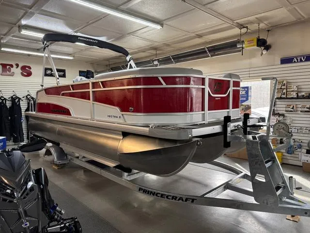 Slide: The Image of 2025 Princecraft Vectra 21 RL 115HP pontoon boat displayed in a showroom. - 2