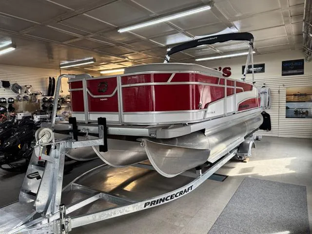 Slide: The Image of 2025 Princecraft Vectra 21 RL 115HP pontoon boat displayed in showroom on trailer. - 4