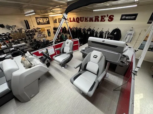 Slide: The Image of 2025 Princecraft Vectra 21 RL 115HP boat interior in showroom, featuring modern seating and controls. - 7