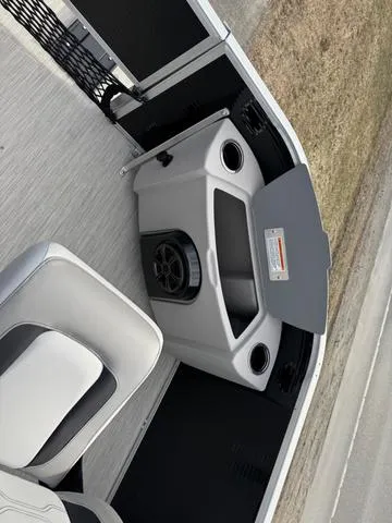 Slide: The Image of 2025 Princecraft SportFisher 21-2S 90HP boat interior with seating and storage compartments. - 10