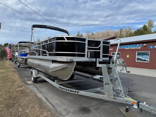Slide: The Image of 2025 Princecraft SportFisher 21-2S 90HP pontoon boat on trailer, parked outdoors. - 4