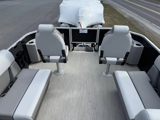 Slide: The Image of 2025 Princecraft SportFisher 21-2S 90HP boat interior with seating and cup holders. - 6