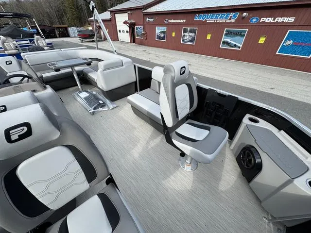 Slide: The Image of 2025 Princecraft SportFisher 21-2S 90HP pontoon boat interior with seating and console. - 8