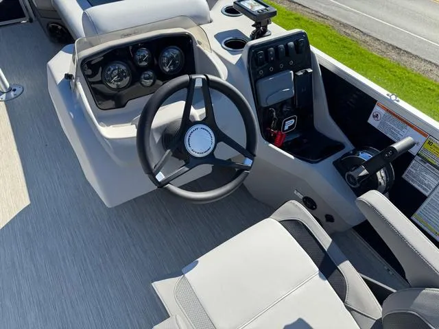 Slide: The Image of 2025 Princecraft Vectra 21 L 90HP boat dashboard with steering wheel and controls. - 7