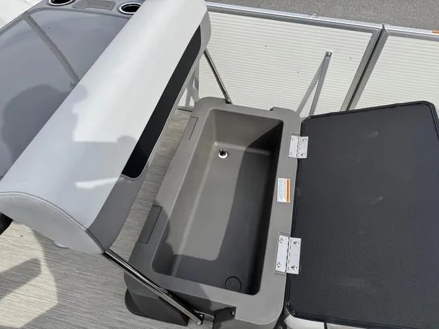 Slide: The Image of 2025 Princecraft Vectra 21 RL 150HP boat storage compartment with seating and cup holders. - 13