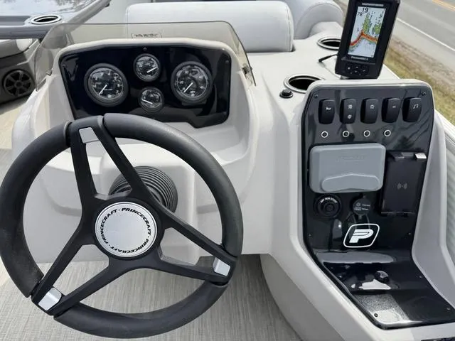 Slide: The Image of Steering console of 2025 Princecraft Vectra 21 RL 150HP boat with gauges and navigation system. - 14