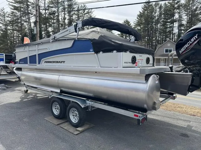 Slide: The Image of 2025 Princecraft Vectra 21 RL 150HP pontoon boat on trailer, parked outdoors. - 4