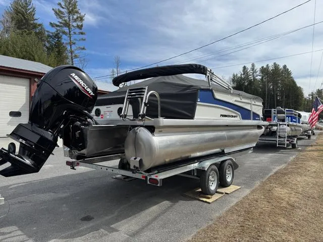 Slide: The Image of 2025 Princecraft Vectra 21 RL 150HP pontoon boat on trailer, parked outdoors. - 5