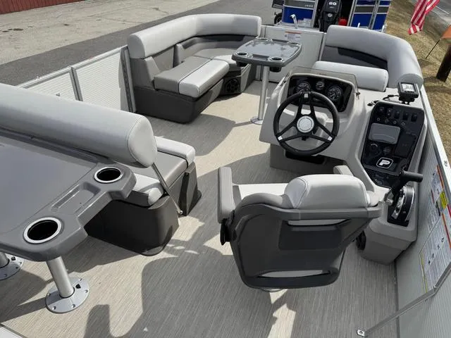 Slide: The Image of 2025 Princecraft Vectra 21 RL 150HP pontoon boat interior with seating and steering console. - 7