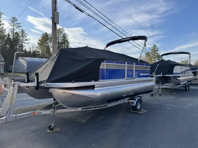 Slide: The Image of 2025 Princecraft Jazz 19-4S 60HP pontoon boat on trailer, covered, outdoors. - 6