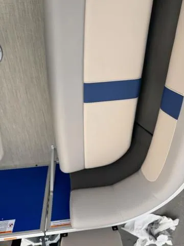 Slide: The Image of 2025 Princecraft Jazz 19-4S 60HP boat interior with beige and blue seating. - 9