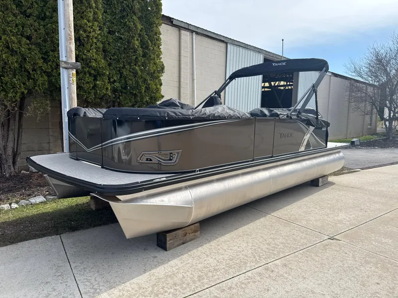 The Image of 2025 Tahoe Pontoon LTZ Cruise Rear Bench on display outdoors. - 0