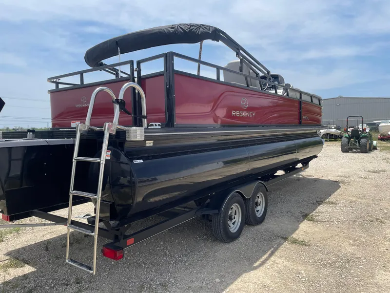 Slide: The Image of 2023 Regency 250 DL3 pontoon boat on trailer, featuring a sleek red and black design. - 6